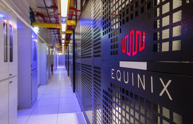 Equinix NY4 data center interior corridor showing branded server cabinet aisle used for forex VPS proximity hosting
